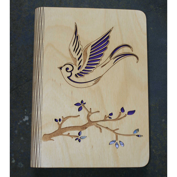 wooden writting notebook cover with a bird and branch design