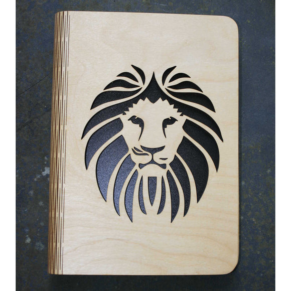 wooden note book cover with a lion's head design