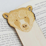 close up of bear detailing with the bookmark in a book