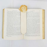chimpanzee bookmark shown being used in a book