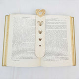 hearts bookmark shown being used in a book