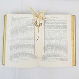hummingbird bookmark shown being used in a book