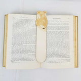 koala bookmark shown being used in a book