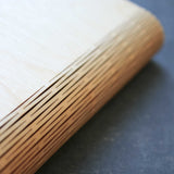 wooden note book cover showing the living hinge flexible spine