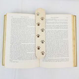 paws bookmark shown being used in a book