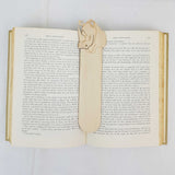 rhino bookmark shown being used in a book