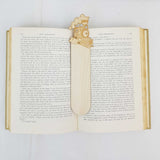 steam train bookmark shown being used in a book