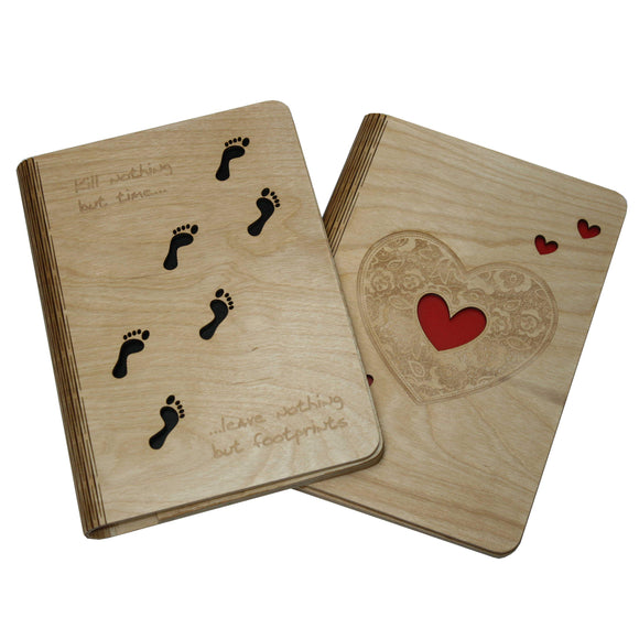Image of 2 A5 Jimagination Creations wooden notebook covers with a footprint and a heart design on.