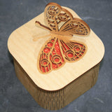 Wooden laser cut & engraved box with a butterfly design in orange