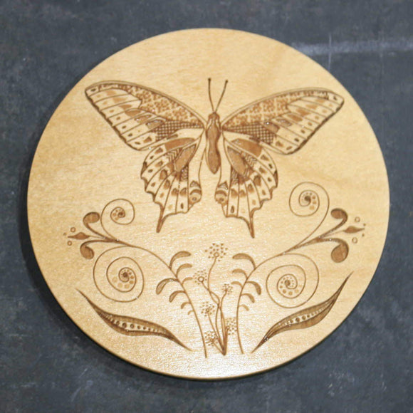 Wooden coaster with a butterfly design