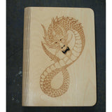 wooden note book cover with a dragon design
