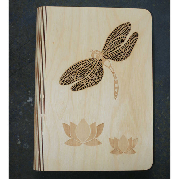 wooden note book cover with a dragonfly design