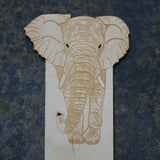 close up of a wooden bookmark with an elephant design