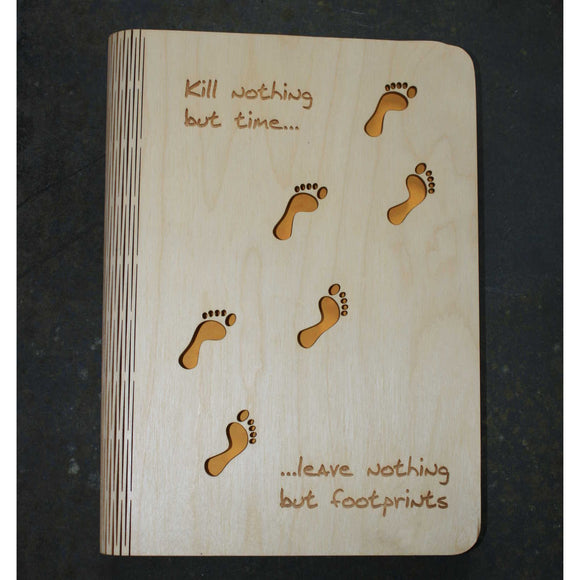 wooden note book cover with a footprints design