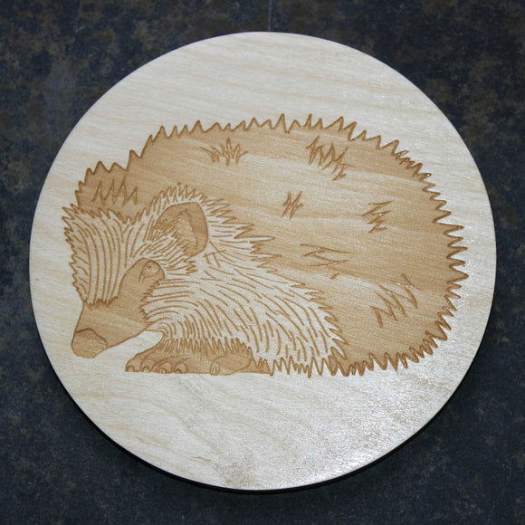 Wooden coaster with a hedgehog design