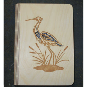 wooden book cover with a heron design