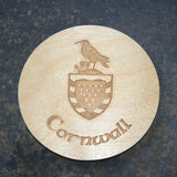 Wooden coaster with a Cornwall shield logo design