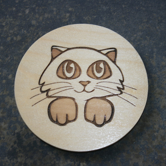 Wooden coaster with a cat head design
