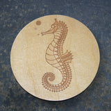 Wooden coaster with a seahorse design