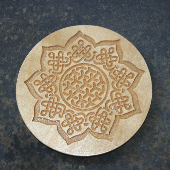 Wooden coaster with a Celtic sunflower design