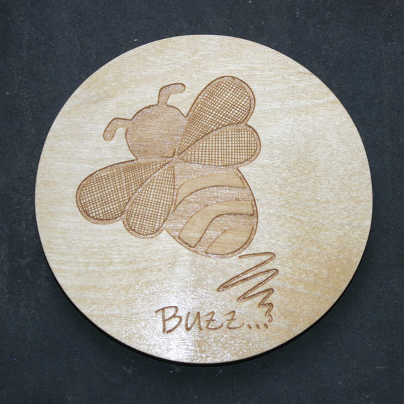 Wooden coaster with a bee design