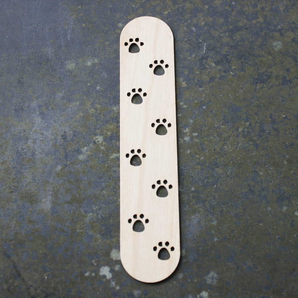 Wooden bookmark with a paw prints design