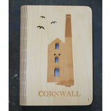 wooden note book cover with a tin mine design