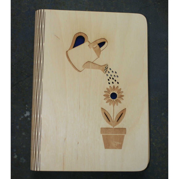 wooden note book cover with a gardening design