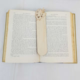 artist bookmark shown being used in a book
