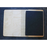 wooden book cover inside with writting pad