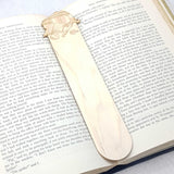 Cooking bookmark shown being used in a book