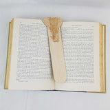 elephant bookmark shown being used in a book