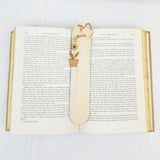 gardening bookmark shown being used in a book