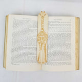 giraffe bookmark shown being used in a book