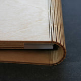 wooden note book cover showing the living hinge flexible spine