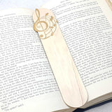 music bookmark shown being used in a book