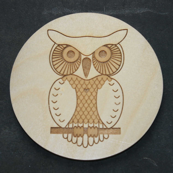 Wooden coaster with an owl design