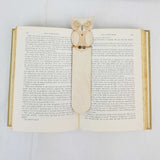 owl bookmark shown being used in a book