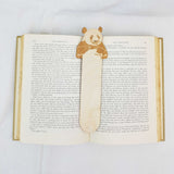 panda bookmark shown being used in a book